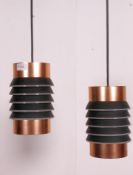 A pair of 1970's retro copper cylindrical drop pendant light shades having squeeze box style