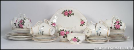 A Royal Trent part tea service in a chintz floral pattern together with another to include cups,