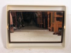 A vintage retro 1970's plastic bathroom wall mirror with backlit frame in cream in good order.