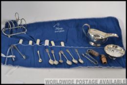 A collection of silver plated wares to include creamer, bon bon dish, silver plate toast rack,