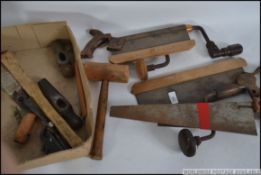A collection of vintage woodworking tools to include Braces, Mitre Saws, miniature planes etc,