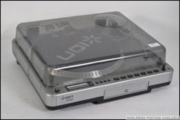 An contemporary vinyl record deck, CD player,