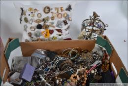 A large collection of assorted vintage and contemporary costume jewellery to include bangles.