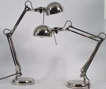 A good clean modern pair of contemporary matching chrome anglepoise style lamps raised on circular