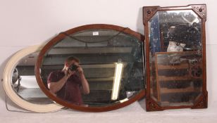 A collection of 3 mirrors from the 20th century to include a mahogany oval wall mirror,