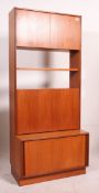 A retro 1970's G-Plan teak wood room divider bookcase having cupboard to the base with upright