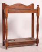 A 1930's oak stick stand having baize lined tier ideal for walking sticks / snooker cues etc.