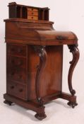 A 19th century rosewood metamorphic davenport desk.