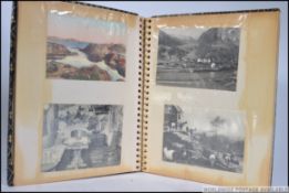 A postcard album consisting of early 20th century continental views to include French Eclesiastical,
