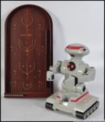 A collectable remote control R.A.D robot, a Star Wars comm talk and a Past Times bagatelle board.