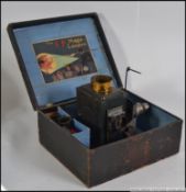 An early 20th century possibly Bing or Marklin made childs Magic Lantern projector kit.