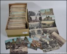Over 700 old British postcards in a shoebox. Nearly all topographical.