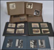 Four vintage albums of photos.