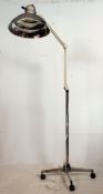 A vintage retro machinist / dentist floor standing Industrial anglepoise lamp having a polished