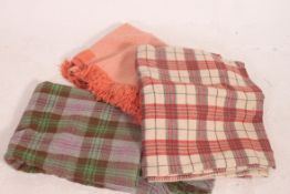 A collection of vintage 20th century picnic woollen rugs to include tartan,