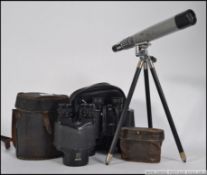A Magnon No 2338 field monocular together with a pair of Tasco binoculars and a small telescope