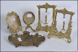 A Victorian cast brass repousse rococo pen tray together with a pair of brass easel photograph
