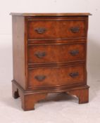 A 20th century chest of drawers together with a shabby chic pine hanging bookcase.