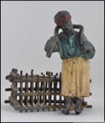 A 20th century Bergman / Namgreb style cold painted bronze spelter figurine of a snake catcher.