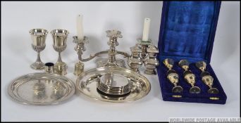 A mixed lot of silver plate to include salt and pepper condiments, trays, 2 medium sized goblets,