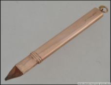 An Victorian hallmarked 9ct gold pencil holder with hoop bale. Hallmarked for Birmingham 1909.