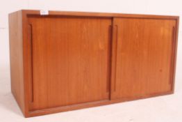 A Danish teak modular wall hanging piece in a retro vintage style.