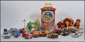 A collection of vintage toys to include Fisher Price Teaching Clock, Pocket Camera,