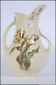 A Victorian ceramic double handled water pitcher / jug of large form by George Jones & Sons in the