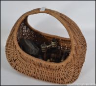 Wicker basket of opera glasses from various eras including bone / ivory ? , mother of pearl ,