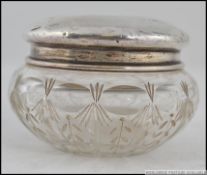 A cut glass pin dish having a silver hallmarked collar, Birmingham assay marks,