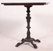 A pair ( one showing) of Granite and cast iron cafe / pub garden tales.