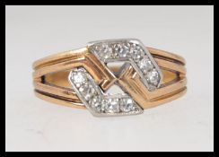 A tested 18ct gold and diamond ring of contemporary hexagonal form with channel set diamonds approx
