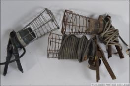 A collection of 3 vintage 20th century trouble lamps / cage inspection lights.