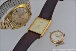 A vintage mid century Gradus gentlemans wristwatch with baton numerals and date aperture.