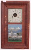 An early 20th century American mahogany cased drop trunk wall clock with painted glass panel.