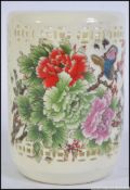 A Chinese brush pot with pierced sides,
