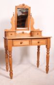 A Victorian style pine duchess dressing table raised on turned legs with drawers having swing