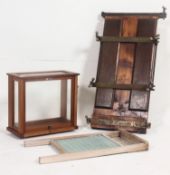 A vintage scientific scales case together with an Irish pine and glass washboard and a vintage