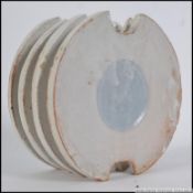 A mid century unusual studio pottery vase of lozenge form with raised ribs all in the manner of