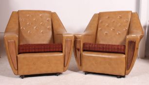 A good pair of 1960's faux brown leather vinyl armchairs having angular frames with moquette