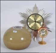 A retro 20th century 1950's Metamec sunburst clock,