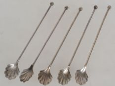 A collection of 5 silver continental sorbet / ice cream spoons having long stems with finial tops,