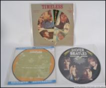 The Beatles - A group of three Beatles 12