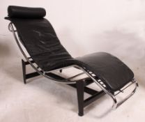 After Le Corbusier LC4 chaise lounge day bed with black leather upholstery and barrel cushion set