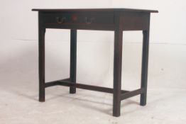 A 19th century mahogany lowboy side table raised on squared legs united by stretchers having single