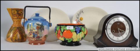 A collection of items to include a hand painted bowl, biscuit barrel, a deco Wade jug,