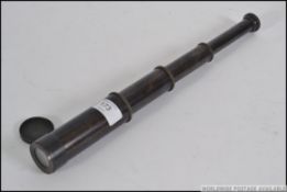 An early 20th century four draw brass telescope with makers stamps for W.