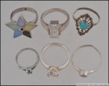A collection of 6 silver 925 / sterling rings to include stone set, turquoise, star set,