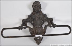 A stunning bronze Coalbrookdale type wall mounted towel rail having back plate in the form of a