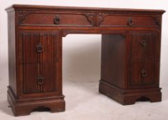 An early 20th century oak Air Ministry style twin pedestal desk fitted with three frieze drawers